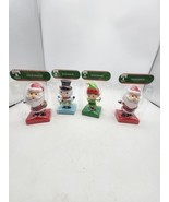 Set Of 4 Christmas House Solar-Powered Dancing Figures In Time Varied - $15.25