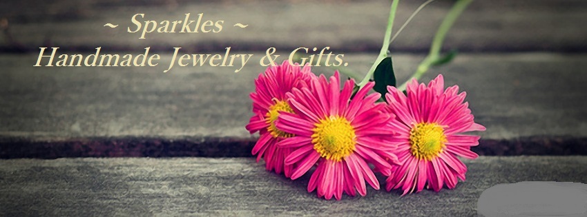 A welcome banner for Sparkles Jewelry & Bags.