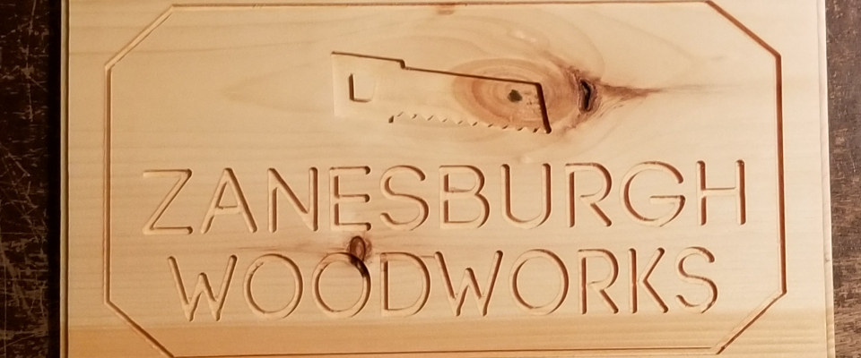 A welcome banner for Zanesburgh's booth