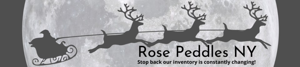 A welcome banner for Rose Peddles NY  booth