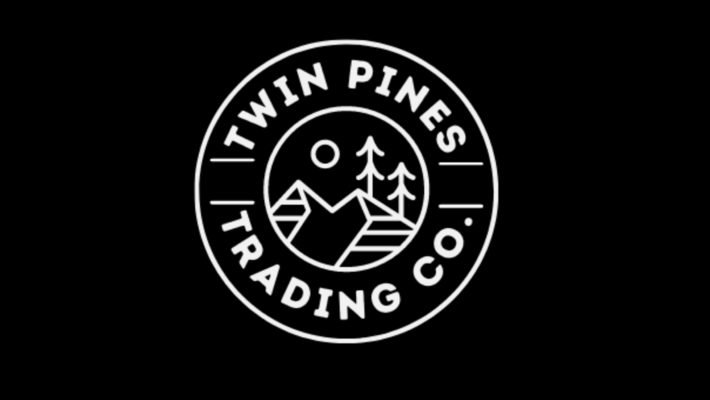 A welcome banner for Twin Pines Trading - Men's Apparel and More